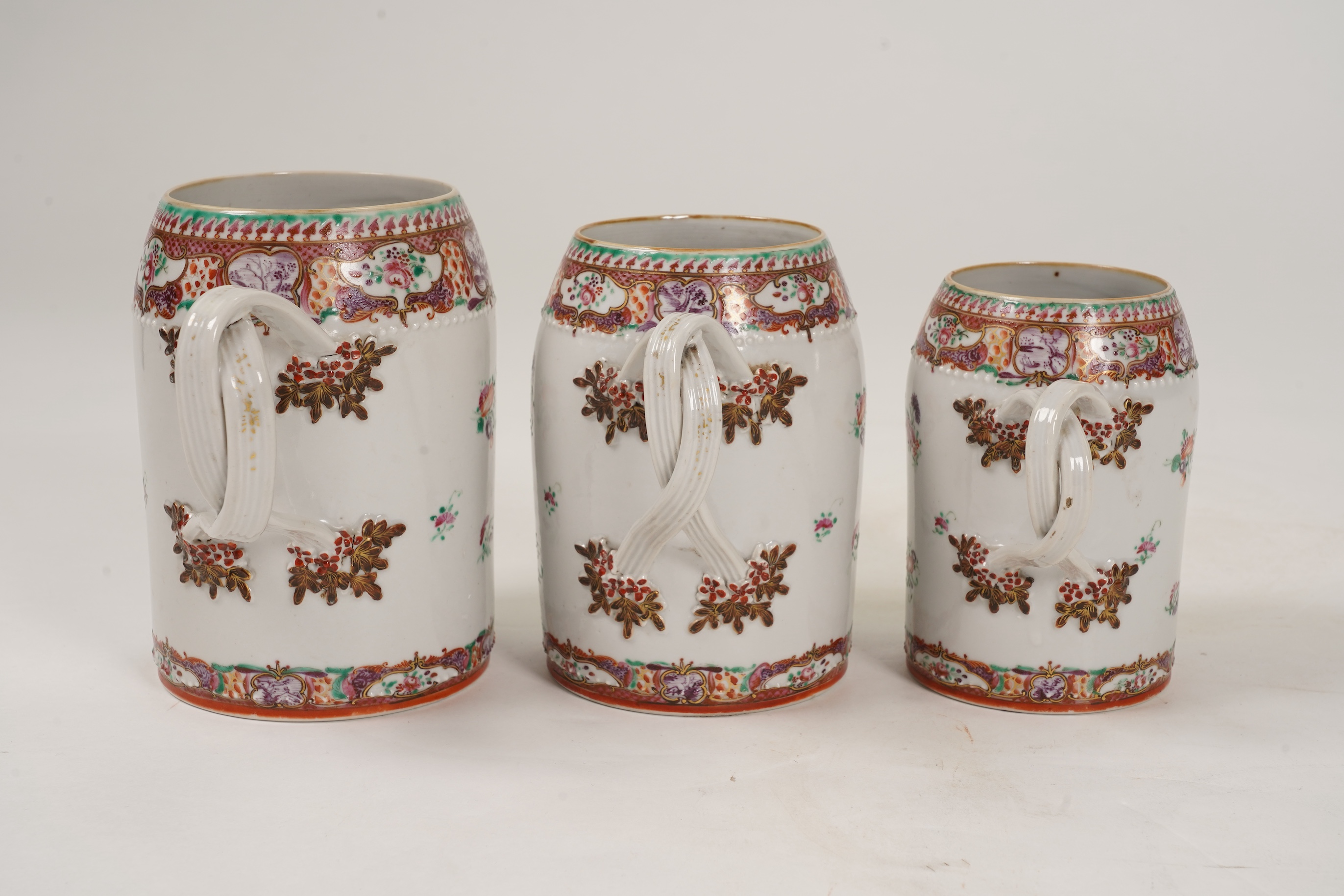 A graduated set of three Chinese export famille rose mugs, Qianlong period
